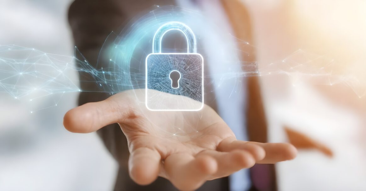 Closeup Persons Hands Typing Laptop Keyboard Illuminated By Screen Dark Room 1163x609